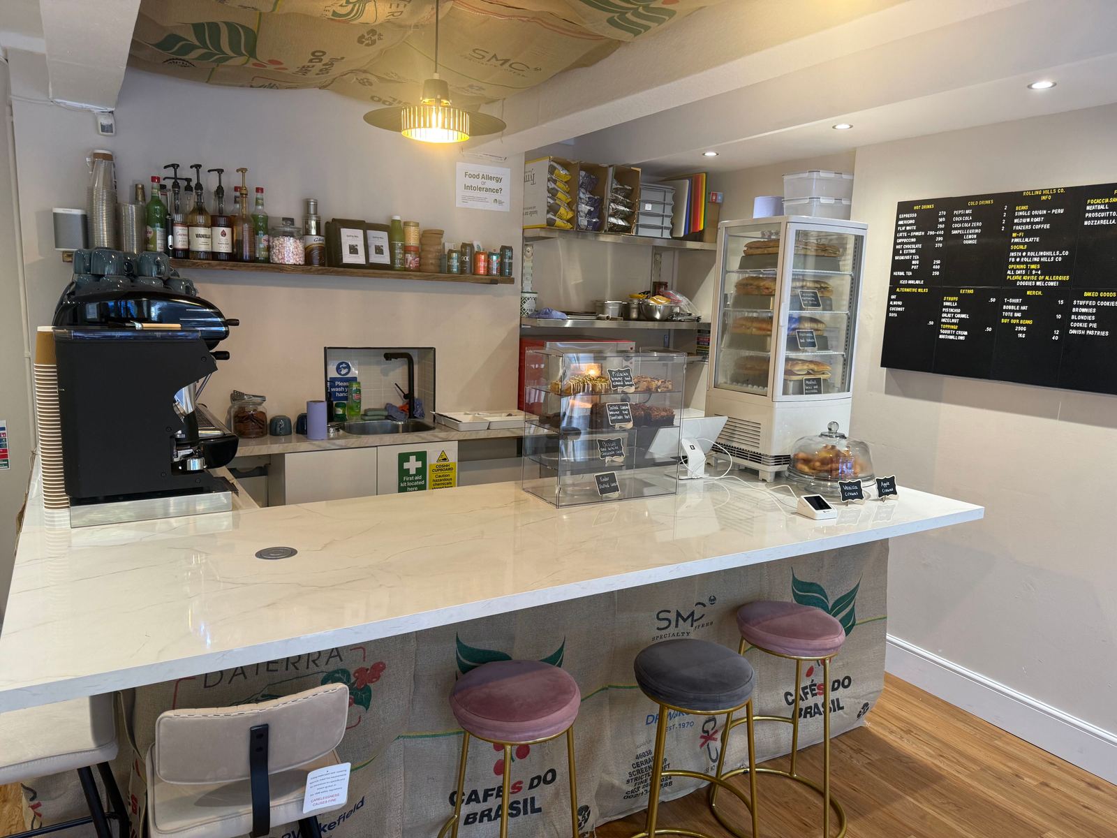 The Rolling Hills counter — coffee machine, cake display and focaccia fridge