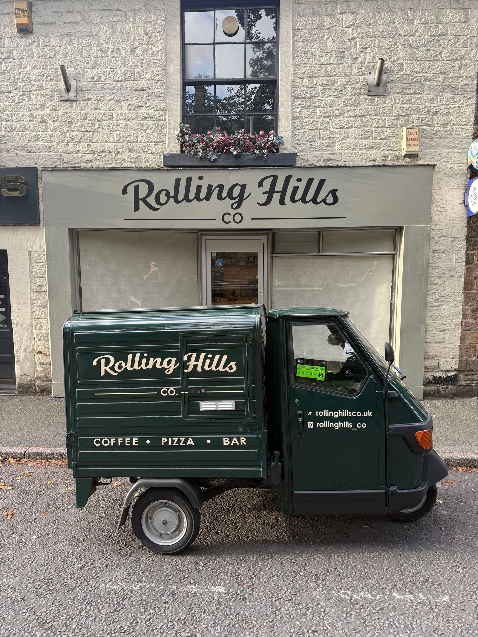 Rolling Hills Co shopfront on Chesterfield Road, Dronfield, with the green Piaggio Ape parked outside