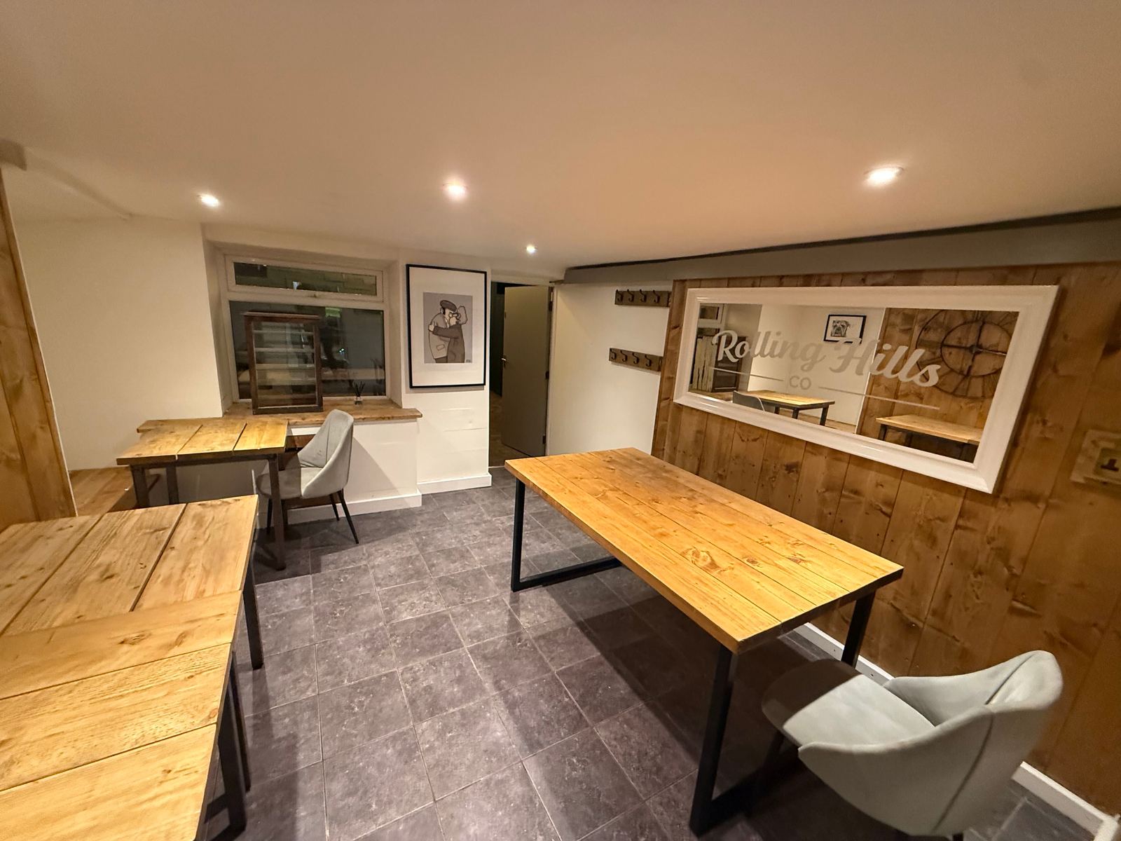 Indoor seating room with wooden tables